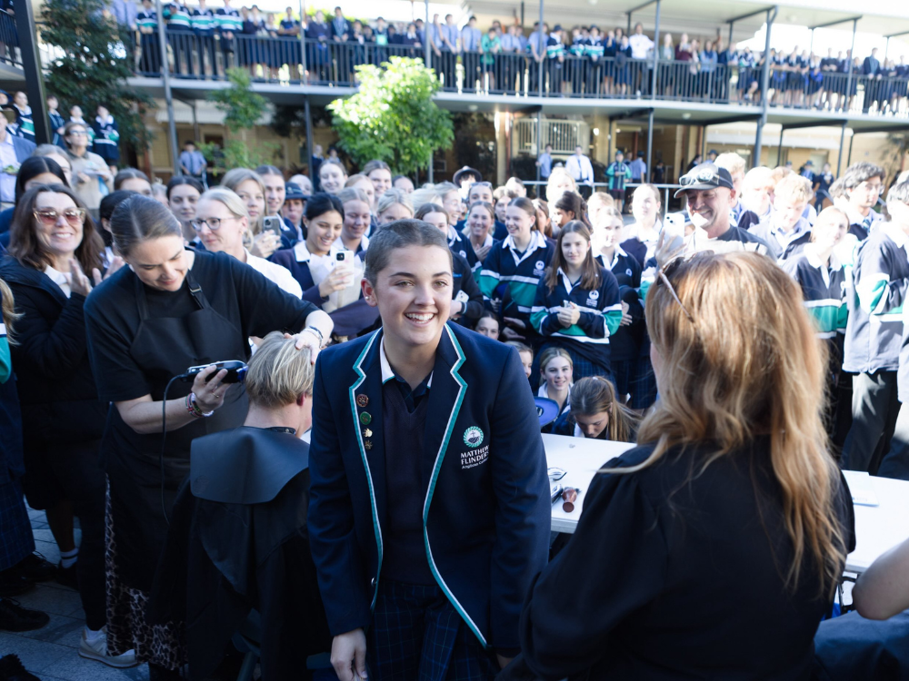 Flinders student shaves head