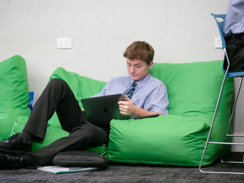 Boy studies on beanbag