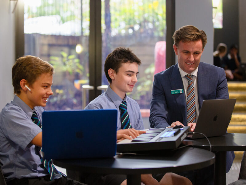 Cade Bonar Head of Music with students in the music classrooms